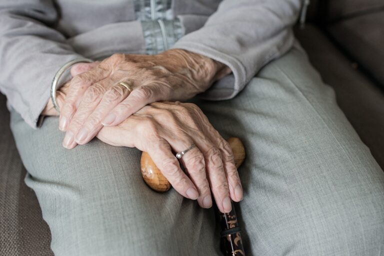 Elderly individual looking contemplative, representing the subject of nursing home care and potential abuse concerns