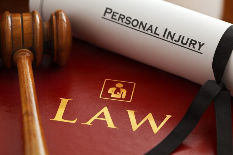 A legal book with personal injury written on a piece of paper, depicting the area of personal injury law practice.