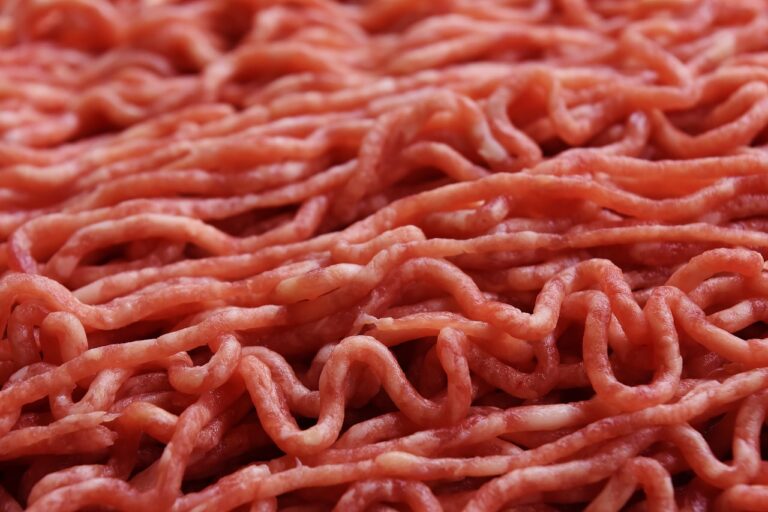 Ground beef on display, representing a common food item associated with potential food poisoning risks and something that could cause someone to hire a food poisoning lawyer.